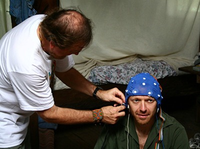 Dr. Juan affixes the EEG skullcap to Rak Razam.