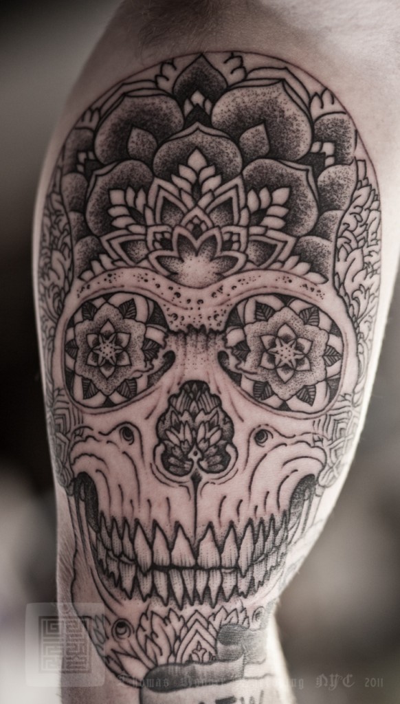 A trippy skull design by Thomas Hooper. He does the most incredibly intricate blackwork, be sure to look up more of his work.